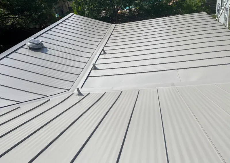Solar attic fan installed on a metal roof for Roof Ventilation in Cedar City